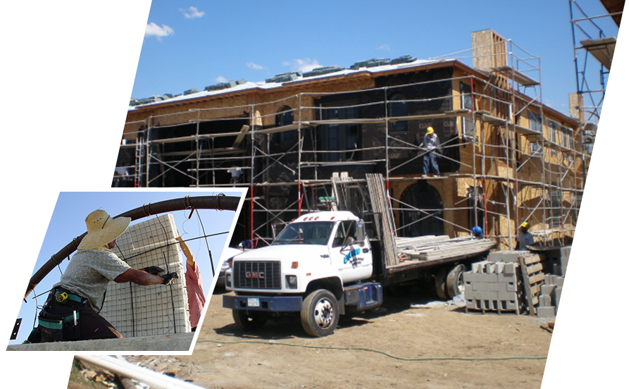 A picture of a building under construction and a man on scaffolding.