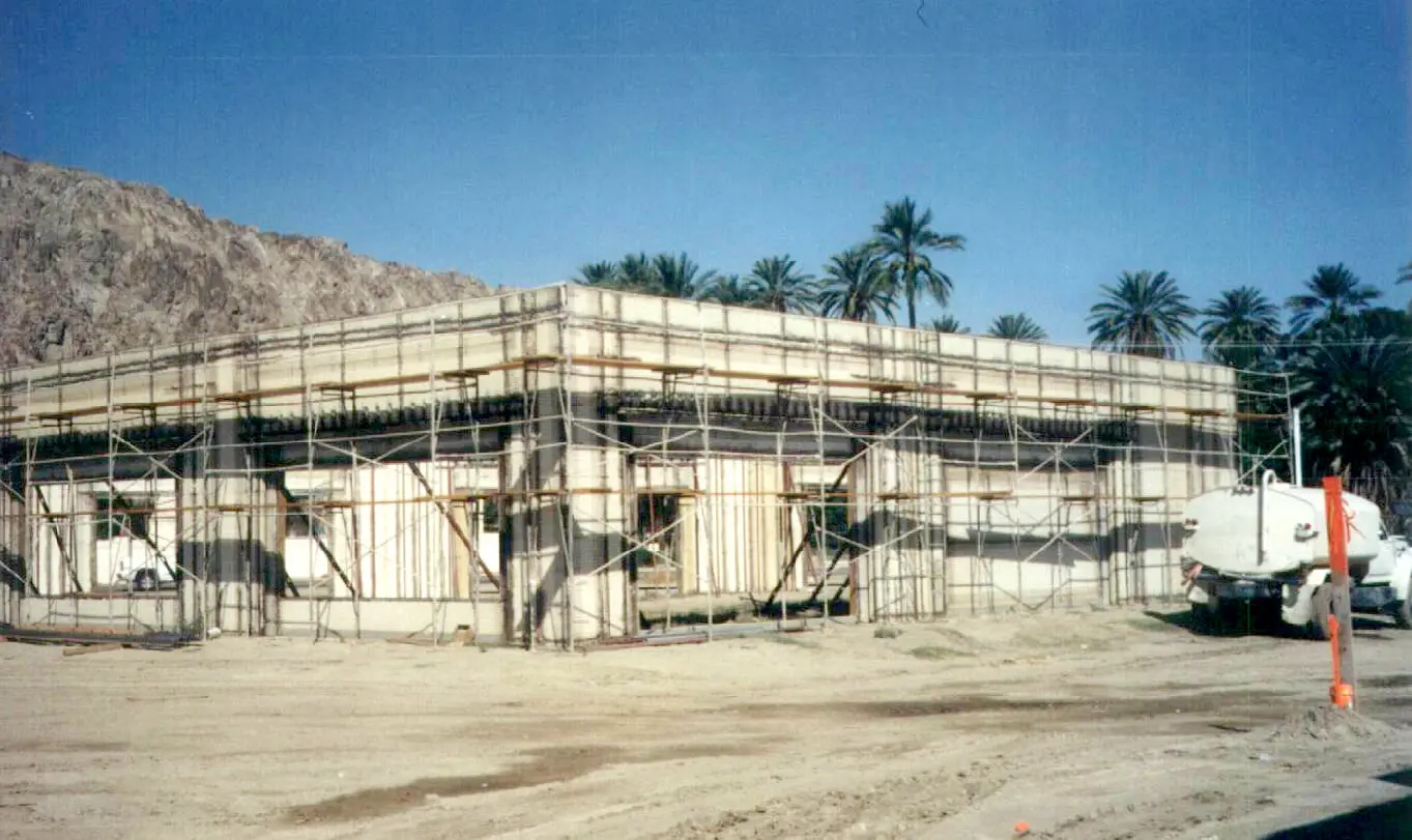 A building with scaffolding in front of it.