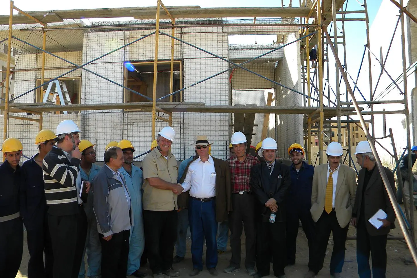 A group of men standing next to each other.