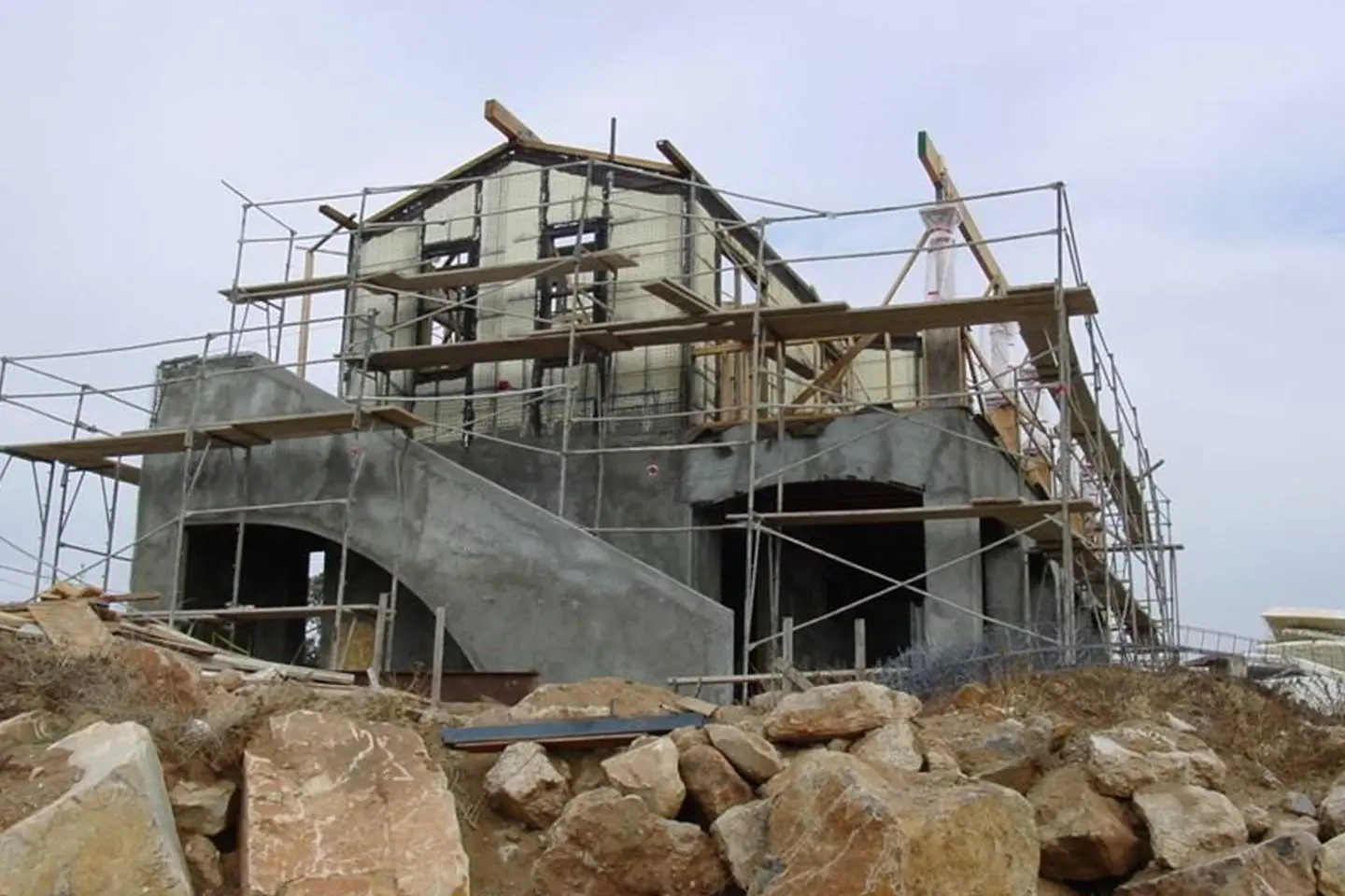 A building under construction with scaffolding around it.