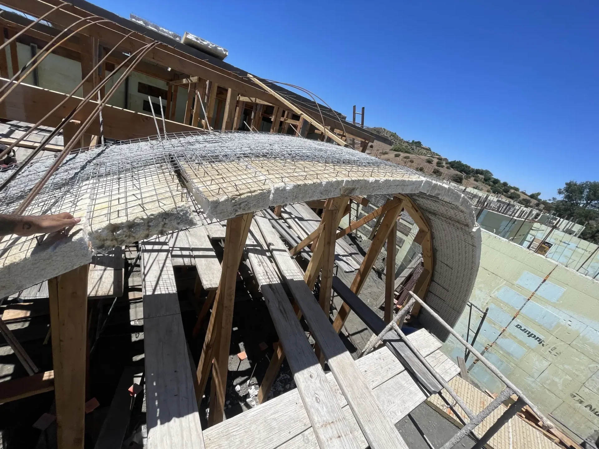 Concrete arch construction with scaffolding.